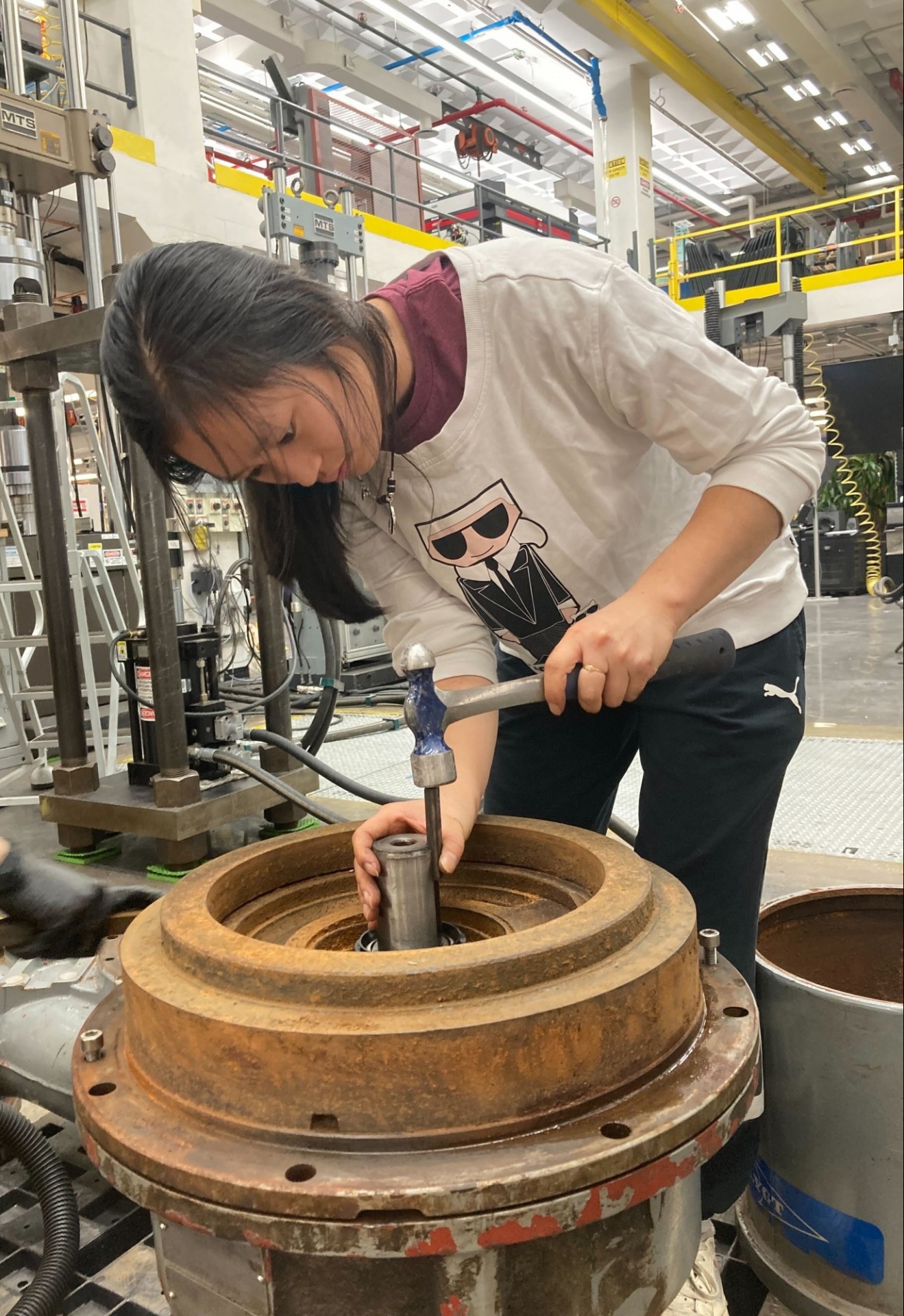 A civil engineering student hammering